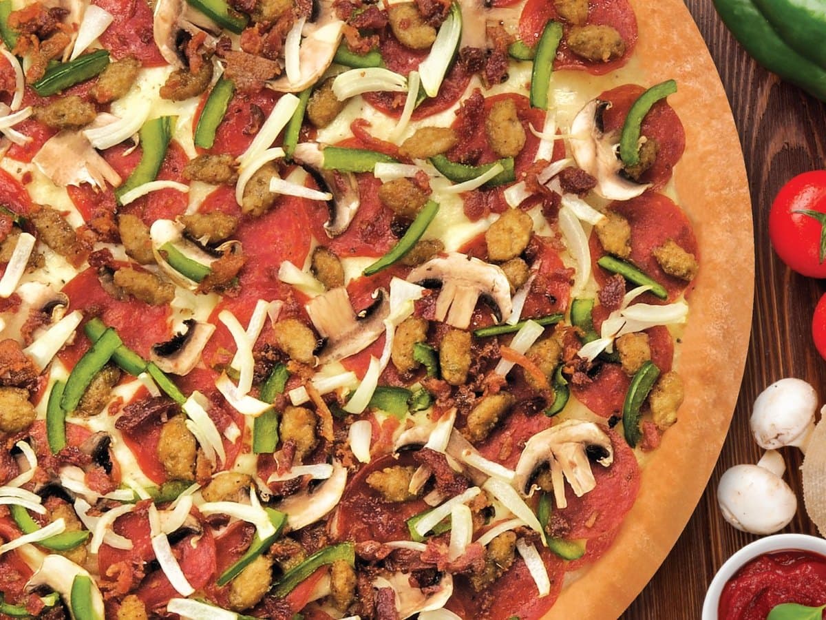 Fresh pizza with vegetables and toppings